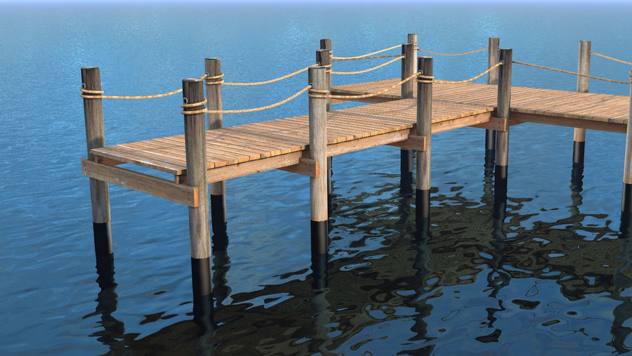 Wooden dock with black wraps on its pilings