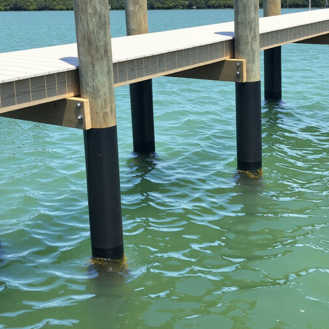 Pier Protector wrap on dock pilings